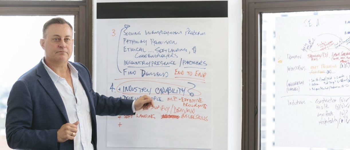 A Response facilitator presenting workshop findings on a flipchart